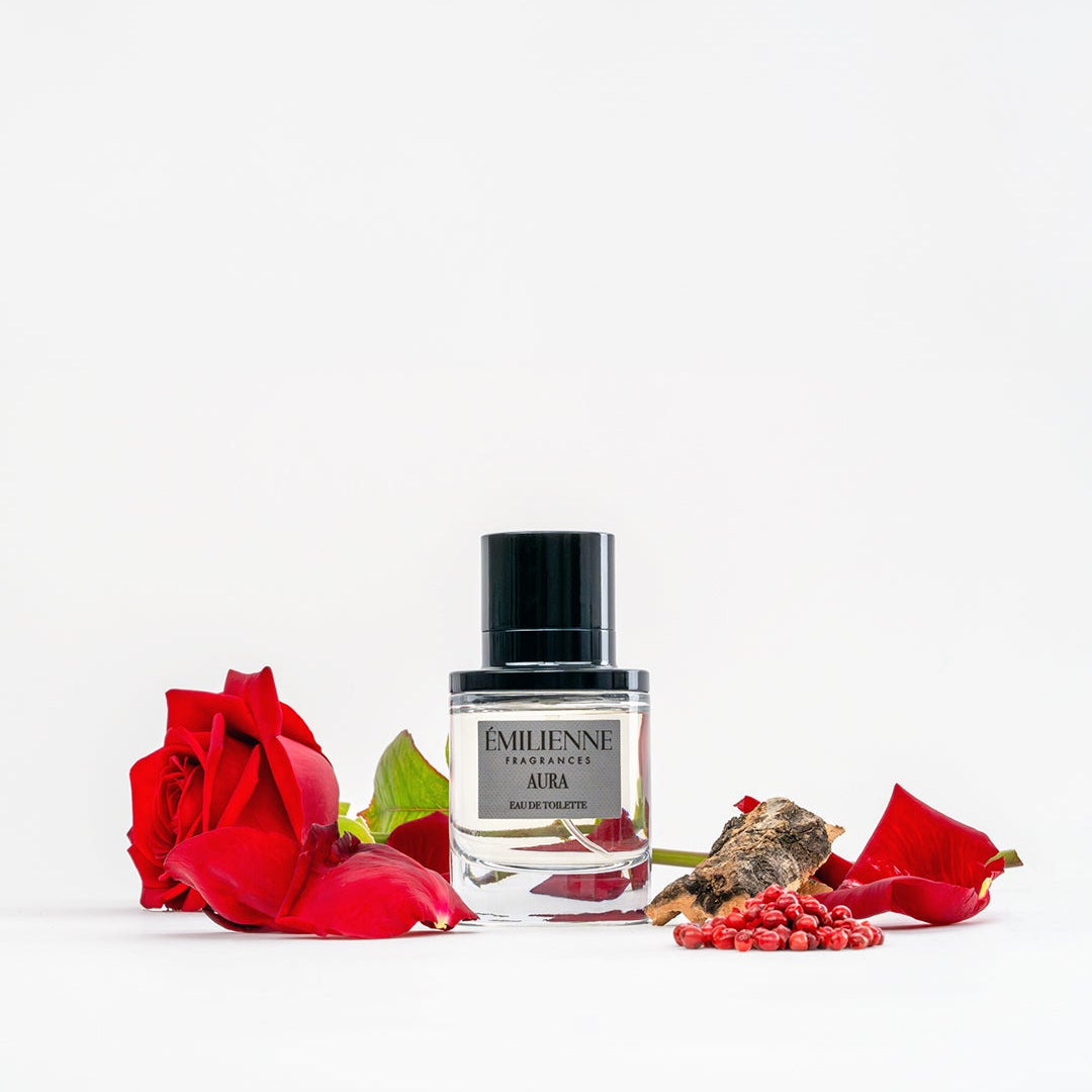 Perfume bottle with red roses on a white background