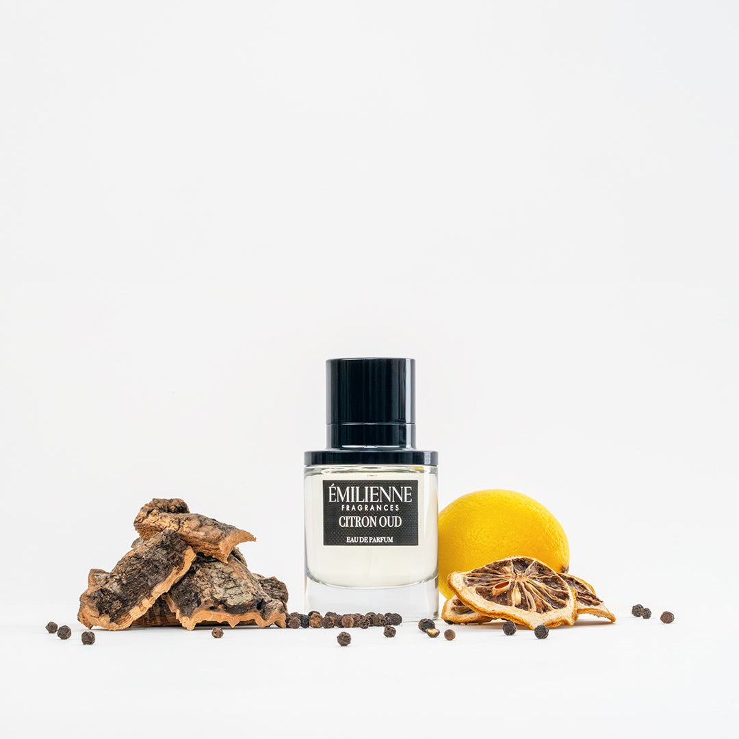 Perfume bottle with decorative elements on a white background