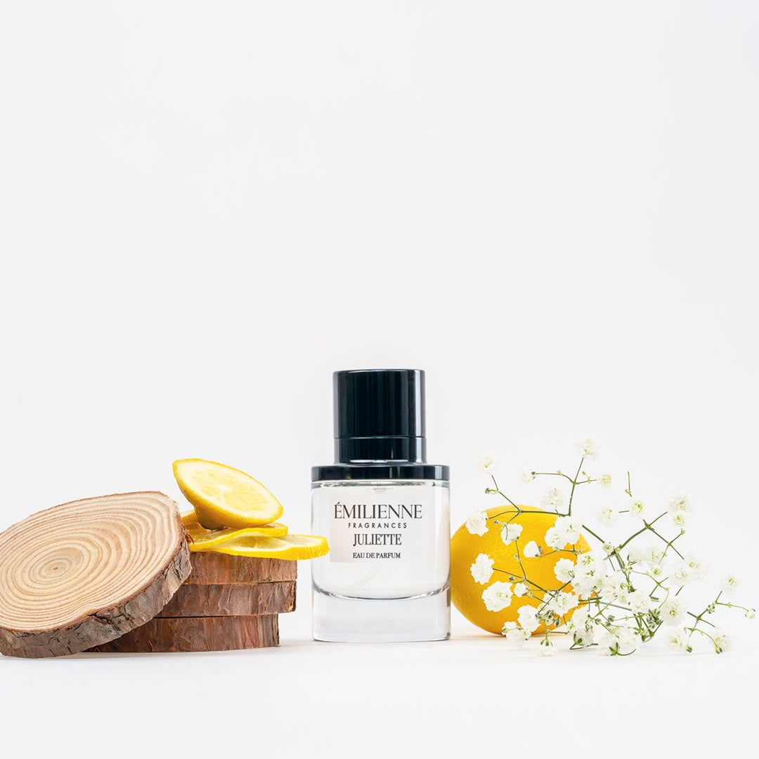 Perfume bottle with decorative elements on a white background